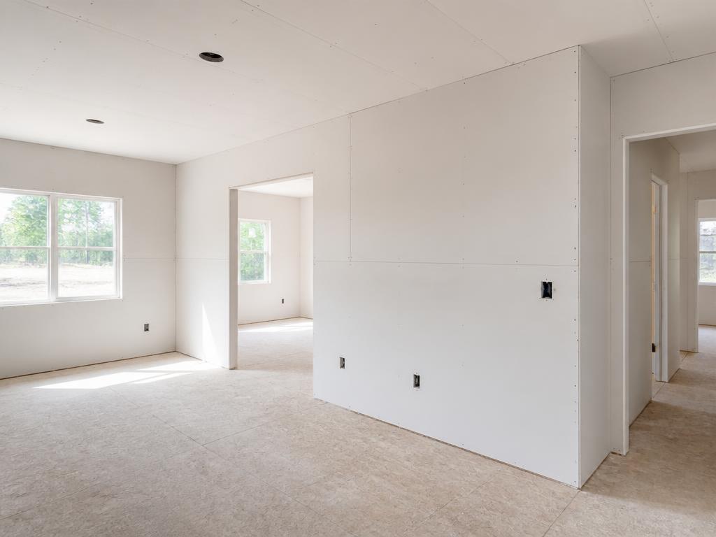 Newly installed drywall in a bright residential home interior