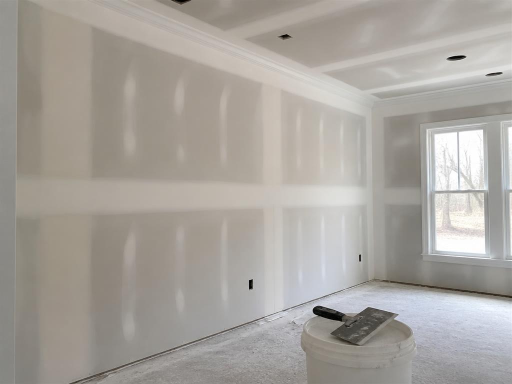 Taped and mudded drywall seams ready for paint